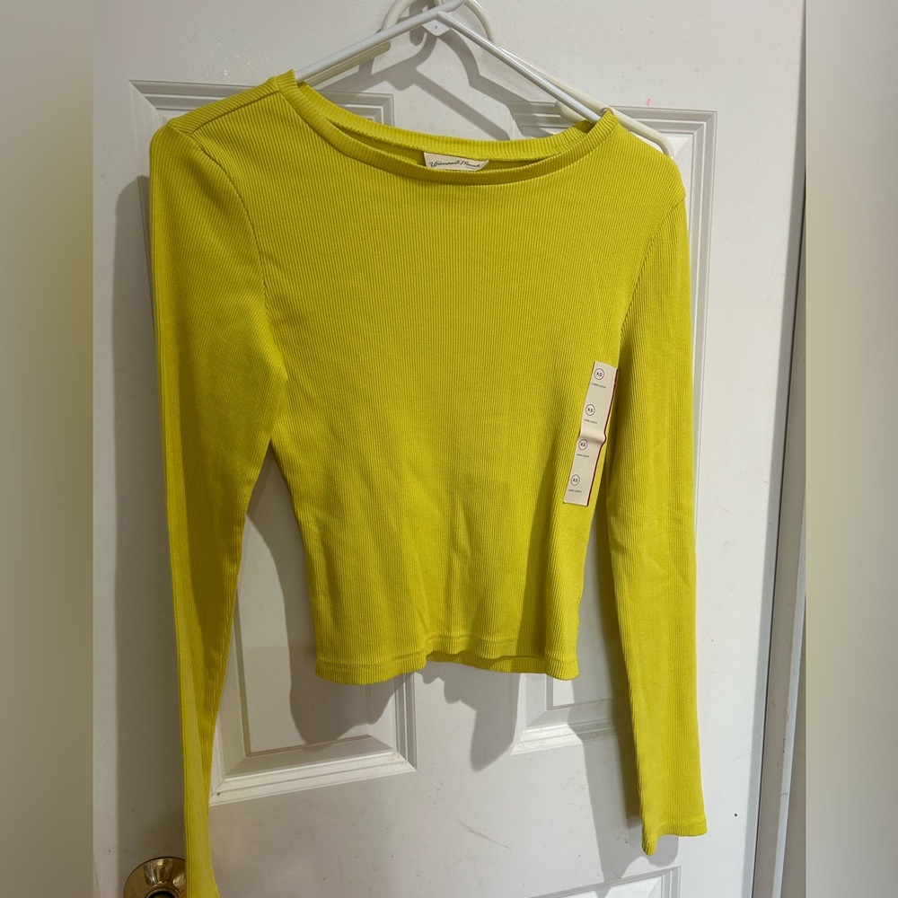 NWT long sleeve shirt. XS. Color is a yellow shade.